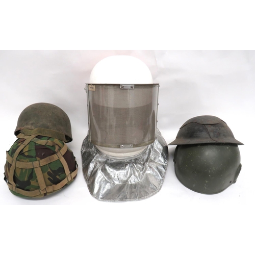 5 x Post War Helmets
consisting RAF Firefighters, white, full head helmet.  Front, flip down visor.  Fireproof neck flap ... Armoured Crew khaki painted green shell.  Black treated linen liner ... 2 x British, fibre combat helmets.  One with camo cover ... WW2 pattern, fibre panel helmet.  No liner.  5 items.