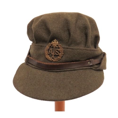 WW2 ATS Other Ranks Service Dress Cap
khaki woollen, soft crown, body and fold up flap.  Stiffened peak.  Leather chinstrap secured by plain button.  Brass KC ATS cap badge.  Silk lining with code stamp "O" 1942.