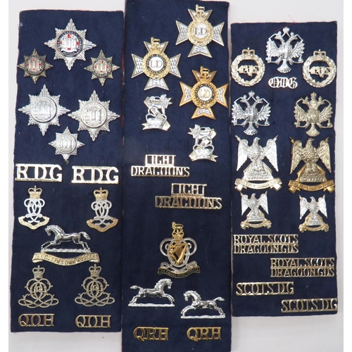 41 x Cavalry Cap, Collar And Shoulder Titles
cap badges include bi-metal Royal Scots Dragoon Guards ... Plated Queens Dragoon Guards ... Bi-metal QC Light Dragoons ... Bi-metal QC Queens Royal Hussars ... Anodised Queens Own Hussars ... Anodised Royal Dragoon Guards.  Collars include anodised Royal Scots Dragoon Guards ... Anodised QC Bays ... Bi-metal Light Dragoons.  Titles include anodised Scots DG ... Anodised Light Dragoons ... QRH ... QOH.  41 items.