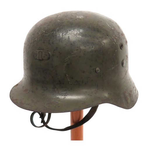 206 - WW2 Pattern Spanish, German Style Helmet
green painted, raw edge, German style helmet.  The front wi... 