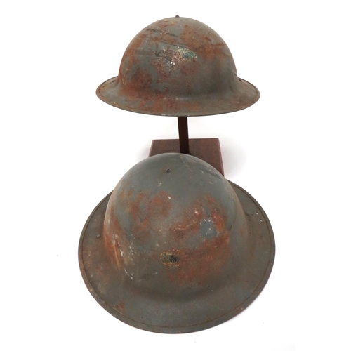 207 - Two WW2 Civil Defence Home Front Factory Helmets
grey painted crowns.  The front with small, ov... 