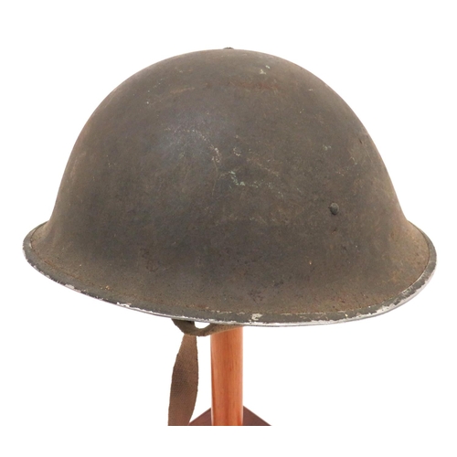 211 - British MKIII Turtle Pattern Steel Helmet
brown painted, rough texture shell.  High side rivets hold... 