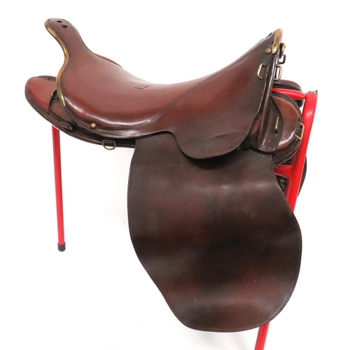 1891/98 Pattern Cavalry Saddle
leather seat with brass edged front and rear spoon.  Brass securing loops and rings.  Leather ended, inner frame.  Large, leather side panels with inner padded leather panels.  Clean condition.