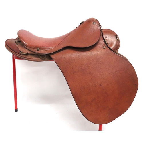 216 - 1912 Pattern Cavalry Saddle
leather seat with brass securing loops and rings.  Leather covered,... 