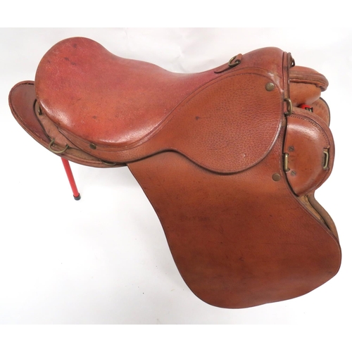 216 - 1912 Pattern Cavalry Saddle
leather seat with brass securing loops and rings.  Leather covered,... 