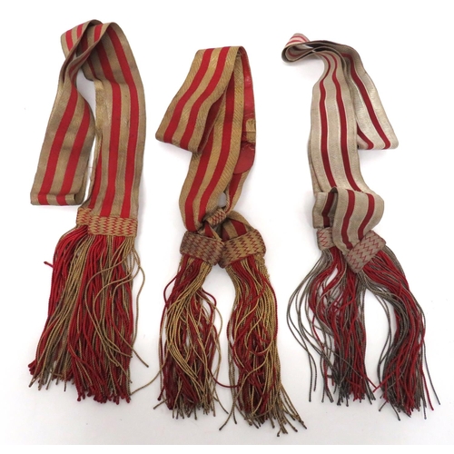 236 - Three Officer Full Dress Sashes
consisting 2 x gilt and scarlet braid examples with lower tassels ..... 