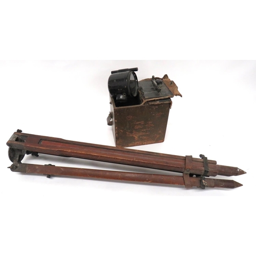 WW1 Period Daylight Signalling Lamp And Tripod
blackened lamp with top mounted sight.  Maker's label dated 1917.  Complete in its fitted wooden box.  The interior lid with Morse key.  Together with its blackened steel mounted, extendable wooden tripod.  2 items.