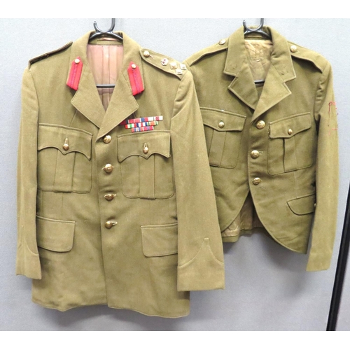 Royal Artillery Brigadier's Service Dress Tunic
khaki, single breasted, open collar tunic.  Pleated chest pockets with buttoned flaps.  Lower hidden pockets with plain flaps.  Shoulders with brass, KC Brigadier rank.  Collar with red Staff tabs.  Left chest with WW2 medal ribbons including DSO.  Brass KC Royal Artillery buttons.  Together with a khaki, open collar doublet.  Pleated chest pockets and lower hidden pockets, all with buttoned flaps.  Brass, KC RA buttons.  Rank and collar badges absent.  2 items.