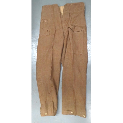 298 - Pair Of 1937 Pattern Battledress Trousers
khaki woollen, wide leg trousers.  Right hip with first ai... 