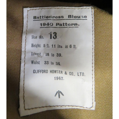 300 - 1940 Pattern Battledress Jacket
khaki woollen, single breasted, closed collar, short jacket.  Lower ... 