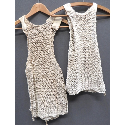 302 - Three WW2 Issue String Vests
white knitted string vests with cotton shoulder straps.  All with tie o... 