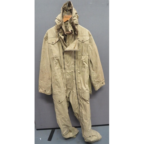 WW2 Dated Tank Crew Winter "Pixie" Oversuit
khaki, heavy, waterproof canvas suit.  Two full length opening zips.  Breast pockets with press stud fastened flaps.  Right hip first aid pocket.  Legs with patch pockets.  Tightening straps to the ankles and cuffs.  Complete with removable hood.  Khaki blanket lining.  Internal right cuff with issue label dated 1944.  Minor wear.  