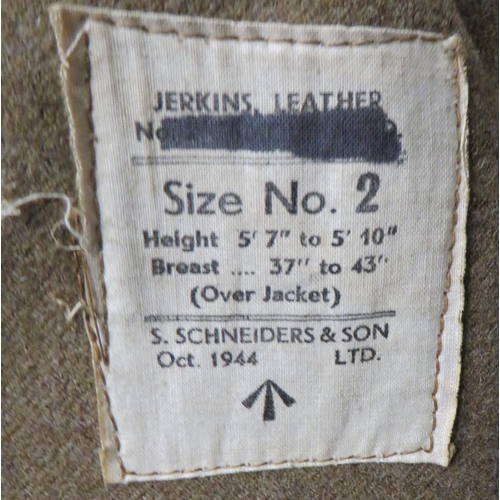 313 - WW2 Dated Leather Jerkin
brown leather, multi panel, sleeveless jerkin.  The front fastened by ... 