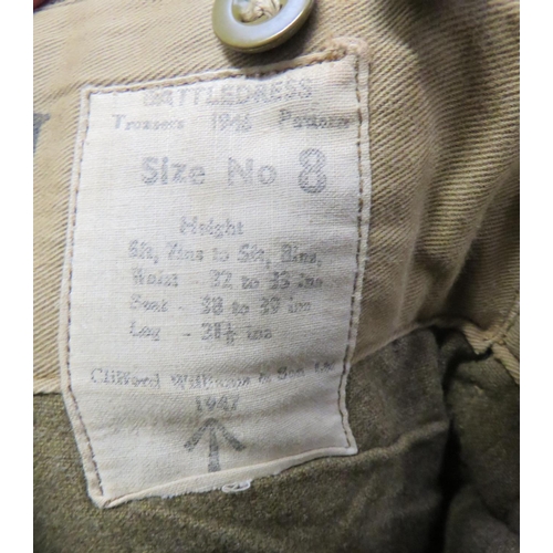 323 - Two Pairs Of 1946 Pattern Battledress Trousers
consisting khaki, woollen, wide leg trousers.  R... 