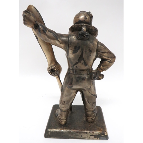 376 - Interwar Airman Table Top Cigarette Lighter
silvered figure of a standing airman in flying suit with... 