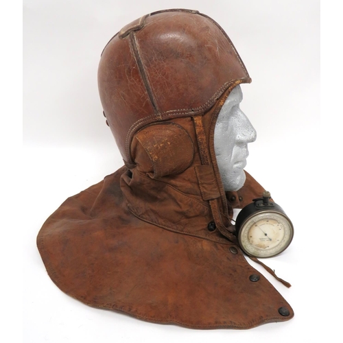 WW1 American Balloon Airship Protective Flying Helmet
brown, hard leather, four panel crown.  Soft leather side panels with half oval ear flaps.  Lower neck and throat flap with front press stud fastening.  Linen lining with ink naming "R W Bell".  Some internal staining and service wear. Together with an altitude instrument .