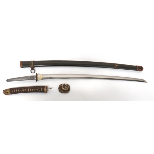 WW2 Military Mounted Japanese Officer's Katana Sword With Signed Tang
26 1/2 inch, single edged blade.  Straight line hammon.  The tang with Japanese character signature "Bishu Ju Namihisa Kore Wo".  Plated habaki.  Brass, floral decorated, military pattern menuki.  Brown cord binding.  Contained in its dark green painted, metal scabbard with darkened military mounts.  Minor chip to blade. 
Complete with photos of tang with translation of signature. 