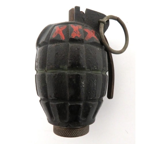 WW2 Inert No 36 Mills Grenade
blackened, fragmentation body.  Painted green, central band.  The top with painted red X.  Maker "T.A & S".  Steel filling plug.  Steel lever retained by split pin.  Steel base plate with no marks.  