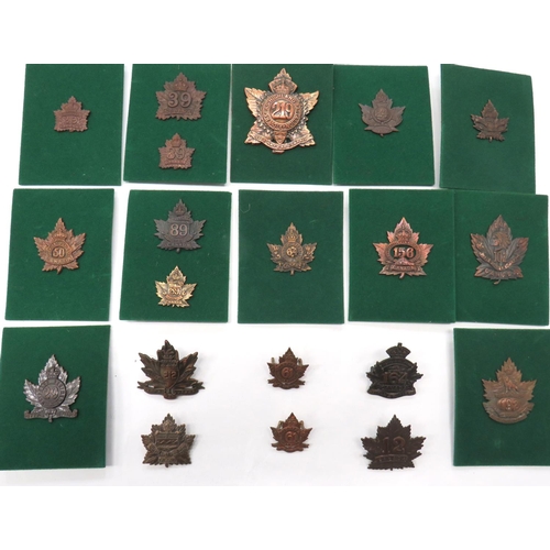 20 x Canadian WW1 Overseas Battalion Cap & Collar Badges
darkened maple leaf example badges include KC 64 Halifax ... KC 164 Halton & Dufferin ... 102 North British Columbians ... KC 50 Calgary ... KC 29 Waterloo ... KC 156 Leeds & Grenville ... KC 192 Alberta ... Pair KC 61 Winnipeg collars.  20 items. 
