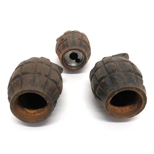 452 - 3 x Inert Drill Practise Mills Grenades
cast fragmentation bodies.  One with drilled holes.  The oth... 