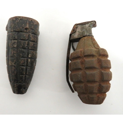 2 x Various Inert Grenades
consisting No 22 MK2 rifle grenade fragmentation head (Pippin grenade) ... American grenade.  Fragmentation lemon shape body.  Cast top and pressed steel lever.  Some rusting.  2 items.
