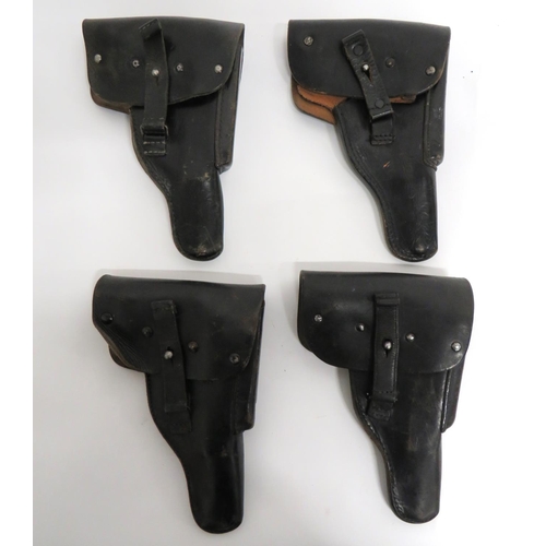 4 x Post War German Pattern P38 Auto Pistol Holsters
black leather holsters.  Top flap secured by leather tab and stud.  Side magazine holder.  Three with rear maker stamps.  4 items.