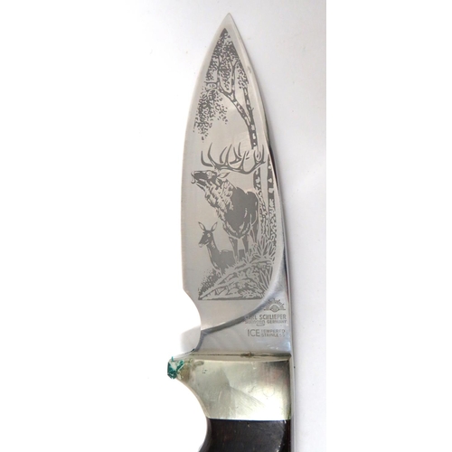 504 - Modern Made German Hunting Knife
4 1/2 inch, single edged blade.  One side etched with deer.  Maker ... 