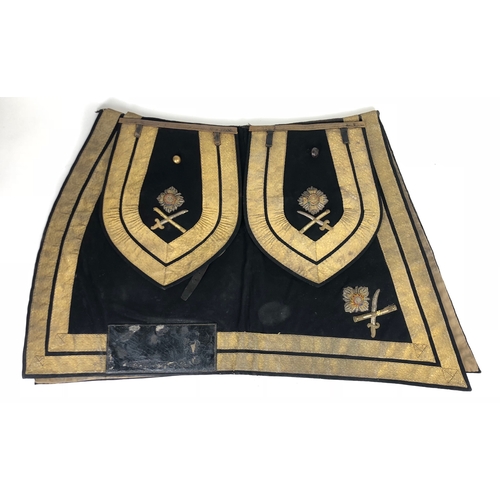 British Army Major General Officers Saddle Cloth   A scarce set of saddle-ornaments for a Major General, consisting of a blue saddle-cloth, edged all round with a twin row of 1 1/2 inch gold oakleaf lace, large badges of rank (star above crossed sword and baton) in the hind corners ... Accompanied by a pair of wallet-covers, also of blue cloth, edged with twin row of gold lace as on saddle cloth, with their matching pointed flounces, bearing embroidered badges of rank as on saddle cloth.  Bullion slightly dulled. GC. (6 items)