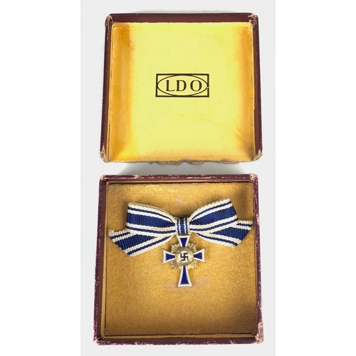 464 - German Third Reich MINIATURE boxed Mother's Cross 3rd Class.  Good bronxe example with blue and whit... 