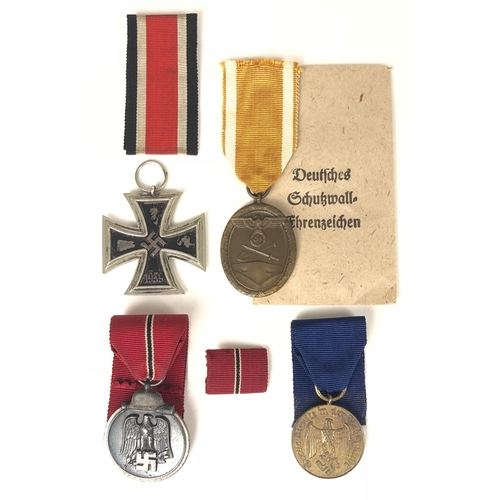 466 - German Third Reich 4 assorted medals.  1939 Iron Crosses 2nd Class ... West Wall Medal with Carl Doe... 