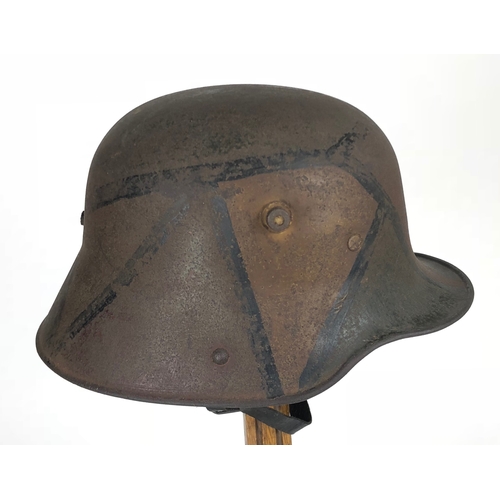 473 - Imperial German WW1 Camouflage Steel Helmet.  A good and scarce example with camouflaged painted fin... 