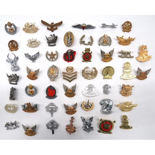 109 - 50 x African Orientated Cap Badges
including gilt Botswana Defence Force ... Anodised Rhodesia Air F... 