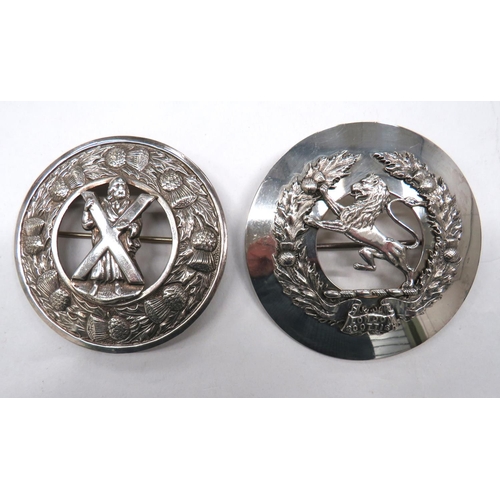 121 - Two Scottish Plaid Brooches
consisting plated disc with overlaid thistle wreath and central lion. &n... 