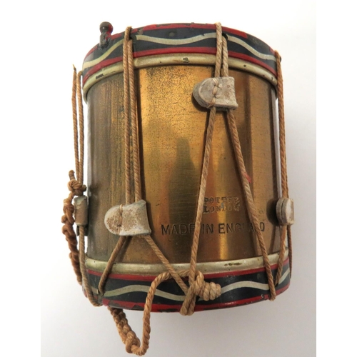 141 - Royal Inniskilling Fusiliers Miniature Drum
brass, miniature drum with cord stringing.  Well pa... 