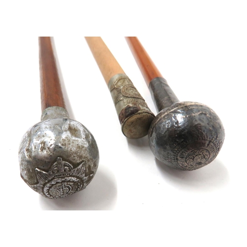 146 - Three Various Swagger Sticks
consisting white metal thimble top embossed with Irish Guards badge.  C... 