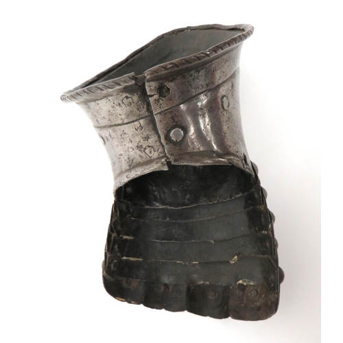 148 - 17th Century Left Hand Gauntlet
steel gauntlet wrist section with line decorated edging.  Five ... 