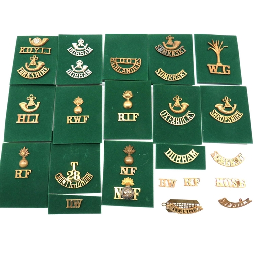 15 - 25 x Brass Infantry Shoulder Titles
including RIF with grenade ... Oxf & Bucks with bugle ... RW... 