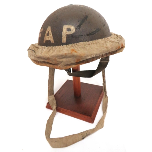 155 - WW2 MKII F.A.P. Steel Helmet And Carrier
brown painted exterior.  The front with white 