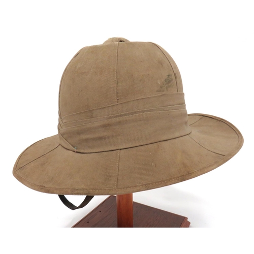 160 - WW2 British Tropical Pith Helmet
khaki tan cotton, six panel crown, pointed peak and rounded rear br... 