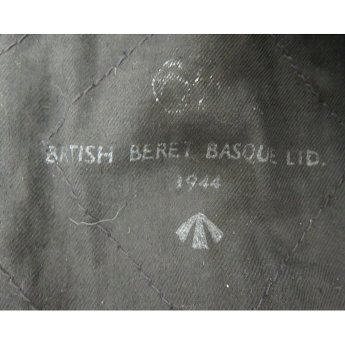164 - WW2 Black Beret Dated 1944
black woollen beret.  Lower, black leather sweatband.  Black co... 