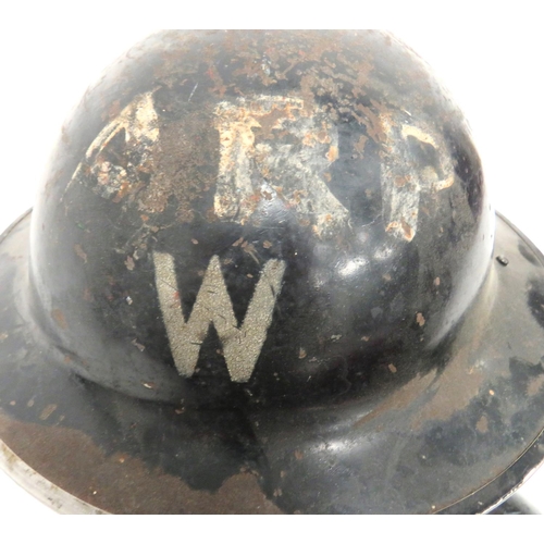 170 - Two WW2 Home Front Steel Helmets
consisting black painted example.  The front with stencilled 