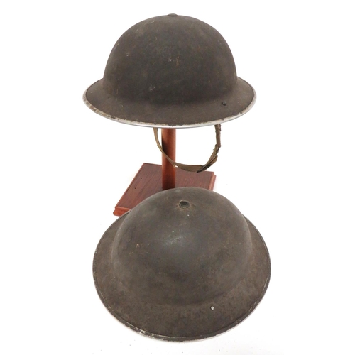 171 - Two WW2 British Steel Helmets
consisting brown finish example.  Black treated linen liner. &nbs... 