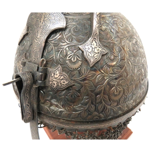 194 - Early 20th Century Indian Kulla Khud Steel Helmet And Chain
steel dome crown, heavily chiselled with... 