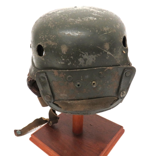 197 - WW2 Pattern American Tankers Protective Helmet
green painted, fibre crown and rear neck flap.  ... 