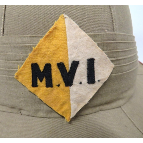 201 - 1930's Malayan Volunteer Infantry Officer's Pith Helmet
khaki cotton, six panel crown.  Pointed... 