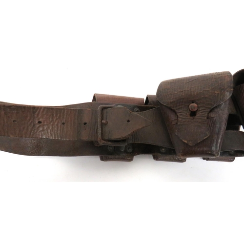 215 - 1903 Pattern Ammunition Bandolier
brown leather strap with five attached pouches.  Top flaps se... 