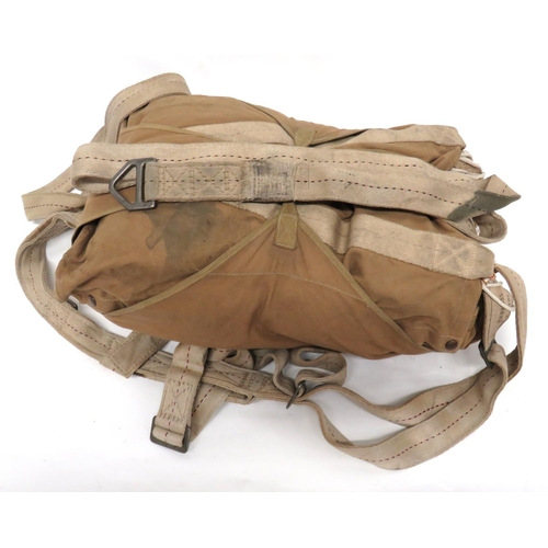 235 - WW2 Pattern Airborne X Type Parachute Harness And Chute
white canvas harness with central red and bl... 