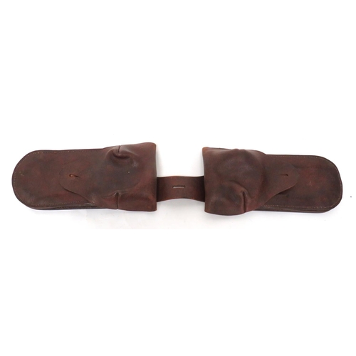 264 - Pair Of Late 19th Century Saddle Wallets
brown leather saddle wallets.  Top flaps secured by br... 