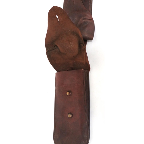 264 - Pair Of Late 19th Century Saddle Wallets
brown leather saddle wallets.  Top flaps secured by br... 