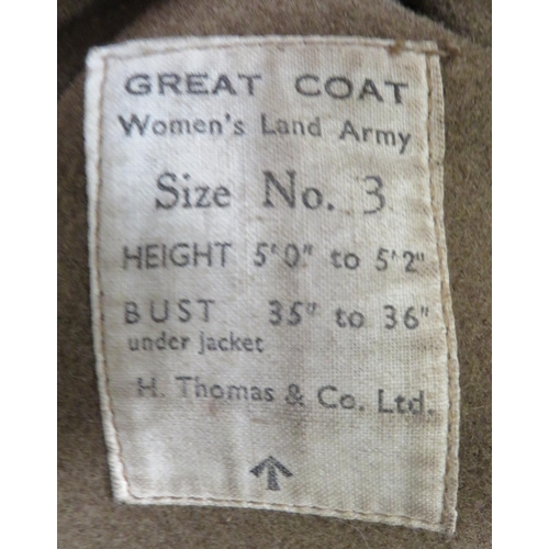 291 - WW2 Women's Land Army Greatcoat
brown woollen, double breasted coat.  Lower hidden pockets with... 